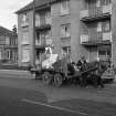 View from WSW showing horse cart passing number 700 Crow Road with number 1 Sackville Avenue in background