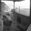 Scanned image of view of interior of gun emplacement showing gun platform and ready ammunition locker