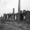 View from ESE showing part of railway viaduct with blast furnaces in background