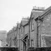 View from NNW showing NE front of houses on N side of Teith Road