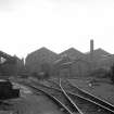 View showing locomotive on right with railway works in background