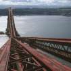 Forth Bridge:  General view from the top of the Fife Cantilever looking south towards the central Inchgarvie Cantilever, with South Queensferry and West Lothian in the background
