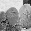 View of cross-incised stones.
Original negative captioned: 'Ancient Stone Crosses at Old Church of Dyce May 1903'.
