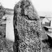 View of reverse of Pictish symbol stone. 
Original negative captioned: 'Migvie Sculptured Stone, (Back) Aug 1903'.