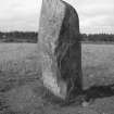 View of standing stone.
Original negative captioned 'Standing Stone. Remains of Circle, at Peathill near Kinmuck. August 1910.'.

