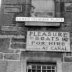 View showing signboard (at Lower Gilmore Place) which is inscribed 'PLEASURE BOATS FOR HIRE AT CANAL'