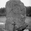 View of standing stone, Hatton of Ardoyne. An umbrella set against the stone provides a scale.
Glass half-plate negative captioned: 'Monolith at Ardoyne / March 1904'.
