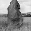View of standing stone.
Original negative captioned 'The Candle Stone, Drumwhindle near Arnage. August 1908'.