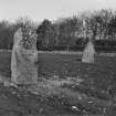 Standing stones in field, near circle.
Negative captioned: "February 1903 Pillars in field to the East of Stone Circle at West Mains Castle Fraser."