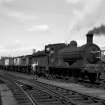 View showing coal train with J36 locomotive on track near station