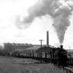 View from NE showing coal train with J36 locomotive on track near upper station, Bathgate.