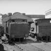 View showing locomotives with buildings in background