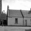 View from N showing NNW front of numbers 1a and 1 Sutherland Steet