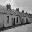View from ENE showing NNW front of numbers 1-27 (odd) Sutherland Street
