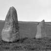 View of two standing stones.
Original negative captioned: 'Remains of Stone Circle with 2 cup marks, Nether Corskie 1904'.
