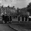 General view of east side of George Square showing gardens and schoolgirls
