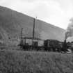 View from W showing locomotive shunting wagons with bing in background