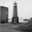 View of leading light beacon, Ayr Harbour, from E showing curved E front.