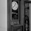 Station headquarters, hall, detail of clocking-in machine