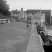 View looking WSW showing harbour with Harbour Cottage, Storehouse, The Old Granary and Warehouse in background