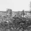 View of uprights of circle and outer kerb of ring cairn from the west.
Print card captioned: 'Northern circle - standing stone of outer circle & back of stone setting with standing stone - west side.'
Perspective opposite to that of KC 376.