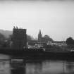 View from NNW showing boat docked at harbour with granary in background