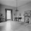 Interior-general view of empty room with piano and fireplace
