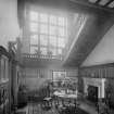 View of staircase and hall showing stained glass window
