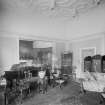View of room adjoining library, with grand piano
