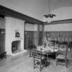 View of dining hall with stained glass window
