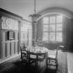 View of dining hall with plaster frieze around room

