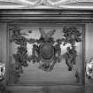 Interior, principal floor, dining-room, detail of carved wooden panel above fireplace.
