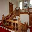 Interior view showing the carved wooden staircase on the first floor seen from the South East.