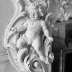 Detailed view of a cherub on the west fireplace in the first floor drawing room of Egremont House.