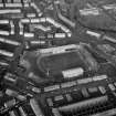 Oblique aerial view centred on St Mirren football stadium, Paisley.