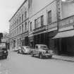 View from SSE showing SW front of store with 16-18 Blackfriars Street in foreground