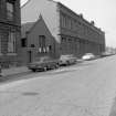 View from S showing ESE front of administration block (Harvie Street block) of tram depot with hall in foreground