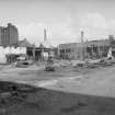 View looking NNW showing works being demolished with lodging house on left