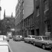 View from NW showing NNE front of building with warehouse in background