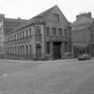 View from SE showing SW and ESE fronts of works with engineering works on left and number 10 and tenement on right