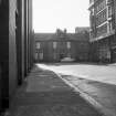 View from N showing NNW front of offices with part of stationery works and number 22 on right