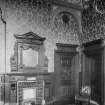 Interior-general view of meeting room showing patterned wallpaper, fireplace with mirror over and doorways
