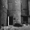 View from WSW showing part of curved WSW front front of base of stair tower on E block