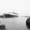 View looking W showing QE II on River Clyde with SSE front of jetty in foreground