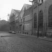 View from SE showing SSW front of warehouse (after it became part of forge) with part of forge on right and left