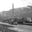 View looking S showing wagons at station with part of mill in background, Galashiels railway station