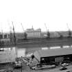 View looking SSW showing NNE front of Springfield Quay with Kingston Bridge under construction on left and part of Mills in background