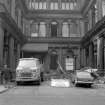 View looking WNW showing ESE front of central part of warehouse with courtyard in foreground