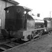 View showing locomotive no.13 (NCB) with diesel and trucks in background