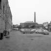 View looking WNW showing part of NNE front of central (N) block of ironworks with part of mill in background